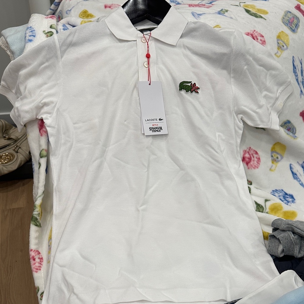 Lacoste White Polo with Stranger Things Logo… never worn! Tags on!